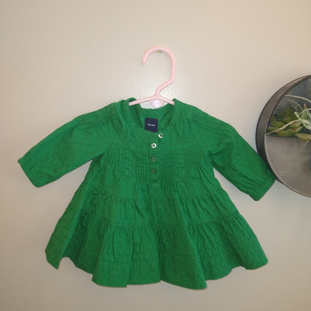 BabyGap green dress diaper cover, stitching details and button closure in front